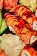 © nazarovsergey - Closeup of nigirizushi with seared salmon and unagi sauce served in sushi set