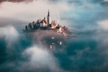 Amazing Panorama Of Lake Bled Blejsko Jezero On A Foggy Morning With The Pilgrimage Church Of The Assumption Of Maria On A Small Island And Bled Castle And Julian Alps In Backgroud