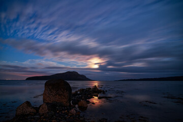 Wall Mural - beautiful cloudscape above the water at sunset.