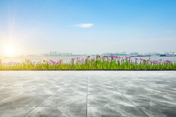 In spring, the flower beds on the side of the stone square in the park