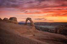 Delicate Arch In Arches National Park With Red Sunset