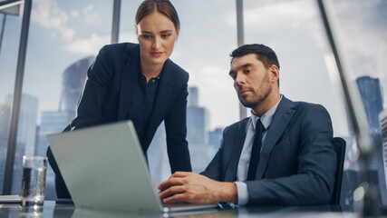Poster - Successful Corporate CEO and Investment Manager Talking, Using Laptop Computer while Sitting in Meeting Room in Office. Two Successful Businesspeople Brainstorm on e-Commerce Marketing Project.