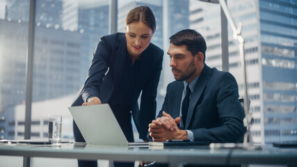 Poster - Successful Corporate CEO and Investment Manager Talking, Using Laptop Computer while Sitting in Meeting Room in Office. Two Successful Businesspeople Brainstorm on Prospective Fintech Investment Deal.