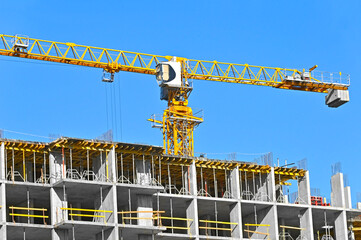 Crane and highrise construction site