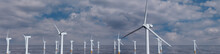 Wind Turbines. Offshore Wind Farm On A Cloudy Afternoon. Environmental Energy Concept.