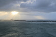 Stormy ocean with cloudy sky with island in the background, view from Castillo San Felipe del Morro, Puerto Rico