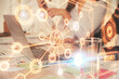 © peshkova - Double exposure of woman hands typing on computer and social network theme hologram drawing. People media concept.