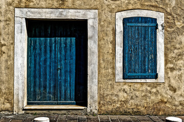 Poster - Beautiful stone building facade with blue wooden window and door in Antibes