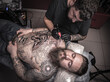 © Mr. Prof - Tattooer makes tattoo pictures in tatoo salon