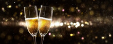 Celebrating New Year 2022 With 2 Glasses Of Champagne On Beautiful Unfocused Background