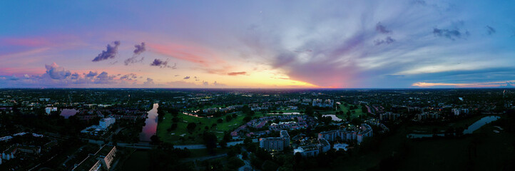 Wall Mural - Aerial landscape view of Fort Lauderdale, Florida during a colorful sunset, shot with a drone