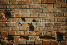 Closeup Of An Old Aged Brick Wall Texture With Bricks Missing From It