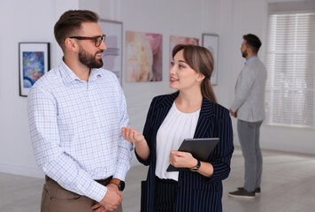 Wall Mural - Happy couple at exhibition in art gallery