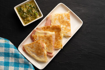 Wall Mural - Ham and cheese quesadilla with flour tortilla. Mexican food