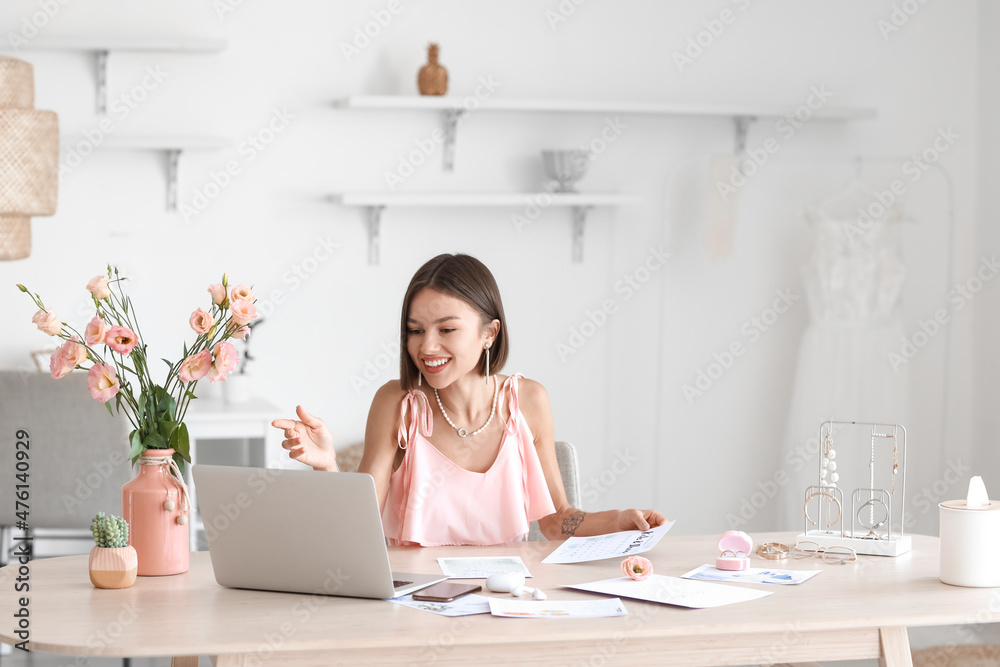 Female wedding planner working in office