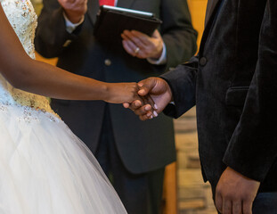 Sticker - Closeup of the bride and the groom holding hands during their marriage