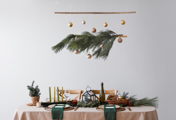 Festive table setting for Christmas celebration in dining room