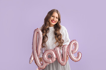 Canvas Print - Beautiful happy young woman with balloon in shape of word LOVE on color background. Valentine's Day celebration