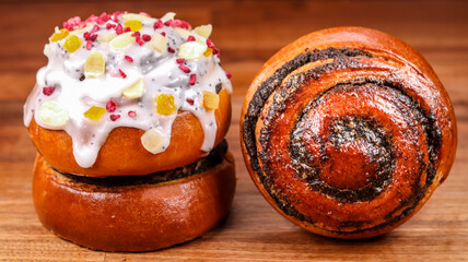 Sticker - Close-up shot of delicious homemade Russian Kulich (Easter Bread) and poppy seed bun on a table