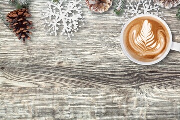 Wall Mural - Welcome 2021 theme coffee cup on wooden table with dried pine branches. Happy new year 2021, Holidays food art concept.