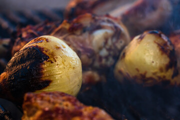 Wall Mural - Closeup shot of chicken steak grilled and meat rolls on a charcoal barbeque