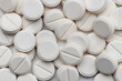 © Kot63 - Lots of round, white pills. Pharmacy. Medicines. Background, wallpaper, texture.