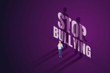 Asian Boy Stands Front Words STOP BULLYING On Purple Wall.