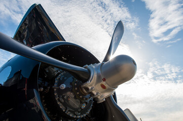 Closeup of an aircraft propeller against a cloudy sk