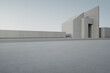 © MIRROR IMAGE STUDIO - Empty concrete floor and white cement wall in city park. 3d rendering of abstract gray building with clear sky background.