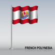 © elzloy - Flag of French Polynesia flying on a flagpole stands on the table