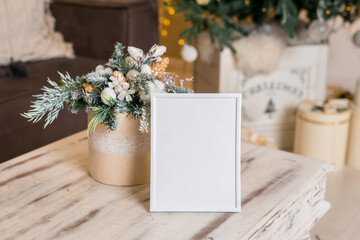 Wall Mural - Christmas photo frame mock up template with decoration on wooden table.