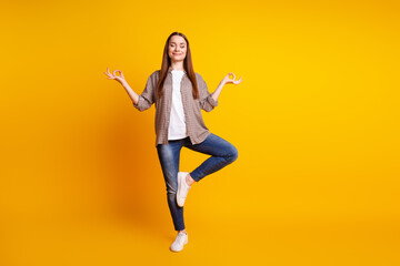 Full size photo of young pretty lady meditate dreamy balance concentration isolated over yellow color background