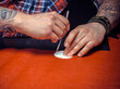 © Mr. Prof - Artist working with leather produces leather workpiece