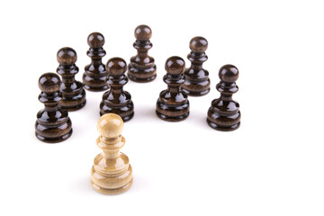 Poster - Single pawn against all black pawns isolated on white background - concept of an unequal struggle