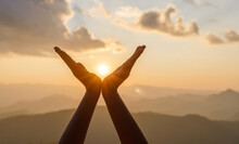 Silhouette Female Hands Holding Sun On Mountain