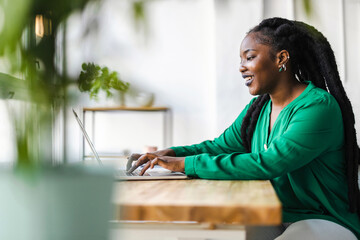 Woman working on laptop in her office
