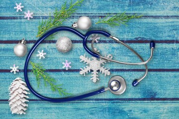 Wall Mural - Christmas, medicine greeting card. Christmas decorations, pills and stethoscope. Medical concept.