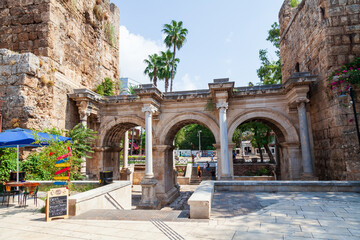 Wall Mural - Famous tourist and archaeological site of Antalya is The Emperor Hadrian's gate in the old city. Travel destinations and vacation in Turkey
