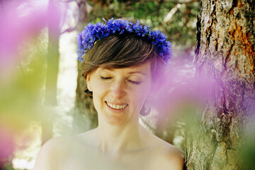 Sticker - Scenic shot of a Caucasian topless short-haired woman with a flower headband