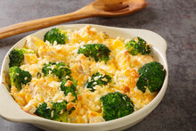 Baked Chicken With Broccoli, Cheddar Cheese In A Cream Sauce Close-up In A Baking Dish On The Table. Horizontal