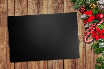 Canvas Print - Christmas greeting card or photo frame over wooden table with gift boxes and decor