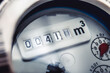 © Bastian Weltjen - Close up of water meter with rotating digit.