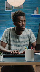 Poster - Businessman working from home with computer in workspace. Corporate worker doing online remote networking on modern device. Entrepreneur typing on keyboard for professional work