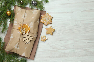 Wall Mural - Wrapped Christmas Stollen with decoration on white wooden table, flat lay. Space for text