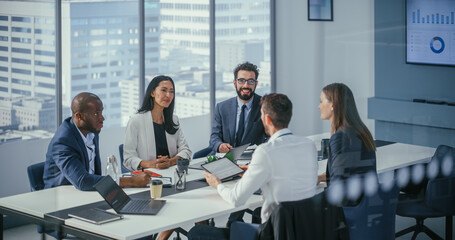 Wall Mural - Modern Multi-Ethnic Office Conference Room Meeting: Diverse Team of Ambitious Top Managers, Executives Talk, Brainstorm, Use Tablet. Businesspeople Discuss Investment Strategy in e-Commerce Startup