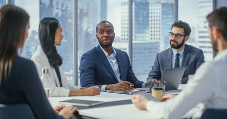 Poster - Modern Multi-Ethnic Office Conference Room Meeting: Ambitious Motivated Black Businessman Presenting Investment Strategy to Partners, Pitching Investment Strategy. Diverse Team Businesspeople Talk