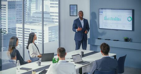 Wall Mural - Diverse Office Conference Room Meeting: Charismatic Black Digital Entrepreneur Presents e-Commerce Fintech Product to a Group of Investors. Wall TV with Big Data Analysis, Infographics, Statistics