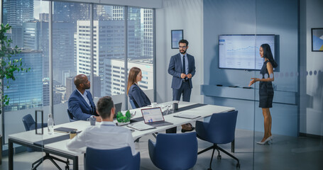 Leinwandbilder - Diverse Office Conference Room Meeting: Male Executive and Asian Female Top Manager Present e-Commerce Fintech Startup Growth Statistics to a Group of Investors. Wall TV with Infographics Data