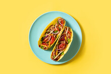 Traditional Mexican Tacos With Meat And Vegetables On Yellow Background