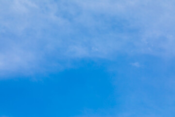 Wall Mural - Blue sky background with white clouds.